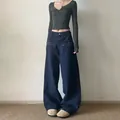 Jeans in denim blu scuro a gamba larga con borchie argentate a forma di stella - S / Blu scuro