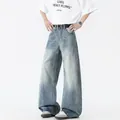 Jeans denim uomo azzurro a gamba larga con lavaggio retrò e cintura nera - S / Blu (Vita Semielastica)