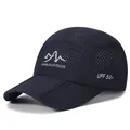 Navy blue breathable folding baseball cap with mountain logo and UPF 50+ rating - One Size Adjustable / Navy Blue