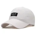 White quick-dry baseball cap with black rectangular logo patch and adjustable strap - Standard / White