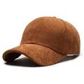 Deep brown corduroy baseball cap with a classic curved brim and textured finish - One Size / Coffee