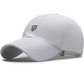 White quick-dry mesh baseball cap with breathable laser-cut holes and silver R-letter badge - White