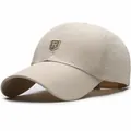 Beige quick-dry mesh baseball cap featuring a golden R shield logo and breathable fabric - Beige