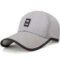 Breathable grey mesh baseball cap for men featuring a black rubber label and honeycomb texture - Adjustable / Light Gray