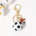 Gold-toned soccer ball keychain with 'I Love Soccer' heart charm for sports fans - Gold Stereo Soccer Heart Tag Style