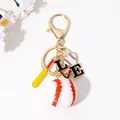 Sporty baseball themed keychain featuring a mini bat and heart-shaped LOVE charm - Gold Baseball Bat Love Style