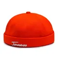 Retro bright orange cotton docker cap with white Jumaomao calligraphy embroidery - Adjustable / Red