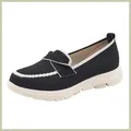 Detail of black knit walking shoes with white trim and thick cushioned soles - EU 35 / Black