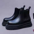 Classic black suede Chelsea boots featuring chunky lug soles and elastic side panels - EU 38 / Black