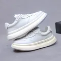 Men's minimalist white leather platform sneakers with cream thick sole and lace-up design - EU 38 / White