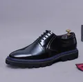 Polished black Oxford shoe with brogue details and a blue midsole accent line - EU 37 / Black