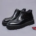 Glossy black leather boots for men featuring front zipper and brogue carved detailing - EU 37 / Black