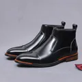 Sleek black patent leather Chelsea boot with side zipper and glossy finish - EU 37 / Black