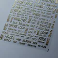 Golden embossed nail stickers with English text and 3D metallic texture design M-021 - Dynamic Words (M-021) / Gold
