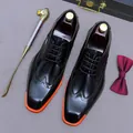 Polished black leather brogue shoes for men with contrasting orange sole and luxury accessories - EU 37 / Black