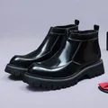 Sleek black patent leather Chelsea boots with chunky platform soles and side zippers - EU 37 / Black