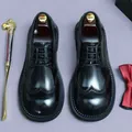 Polished black leather brogue shoes with wingtip detailing and elegant lace-up closure - EU 37 / Black