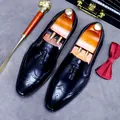 Classic black leather tassel loafers with wingtip brogue detailing and formal accessories - EU 37 / Black