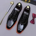 Polished black leather oxfords with contrasting orange sole and detailed embroidery - EU 37 / Black