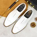 Men's white leather wingtip brogue oxfords with elegant perforated carving details - EU 37 / White