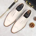 Elegant men's beige leather brogue shoes with classic wingtip carving and lace-up design - EU 37 / Off White