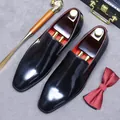 Polished black patent leather loafers for men featuring a striking red inner lining - EU 37 / Black
