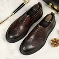 Men's dark brown brogue shoes with decorative perforation and thick black soles - EU 38 / Coffee