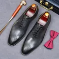 Classic black leather oxfords featuring intricate European embossed detailing and laces - EU 37 / Black and Gray