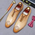 Tan brown leather oxford shoes with laser-engraved brogue patterns and wooden shoe trees - EU 37 / Earthy Yellow