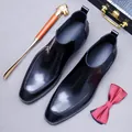 Polished black leather Chelsea boots with lion-head shoehorn and spotted bow tie - EU 37 / Black