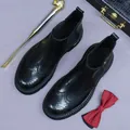 Classic men's black leather Chelsea boots with wingtip brogue patterns and elastic side panels - EU 38 / Black