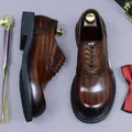 Classic brown Oxford shoes with brogue detailing and vintage wood-grain leather finish - EU 37 / Coffee