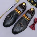 Dark brown leather brogue shoes with tassels and wooden shoe trees in a gentleman setup - EU 37 / Black and Gray