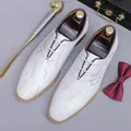 White leather oxford shoes for men with elegant cursive script printing and wooden shoe trees - EU 37 / White