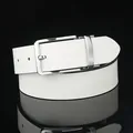 Close-up of men's white leather belt with textured surface and silver buckle reflecting on black surface - Standard Size / White