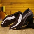 Detail of brown patent leather loafer with floral embossing and gold metal toe cap - EU 40 / Brown