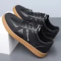 Men's black leather casual sneakers with litchi texture and brown rubber sole - EU 38 / Black