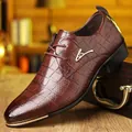 Detail of men's brown dress shoe with crocodile texture and gold metal accents - EU 40 / Black Brown 1878