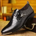 Detail of black patent leather dress shoes with crocodile texture and gold metal accents - EU 40 / Black 1878