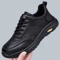 Men's black leather casual sneaker with thick sole and golden metal accent - 38 / Black