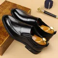Classic black leather slip-on loafers with textured surface and premium wooden shoe trees - EU 38 / Black