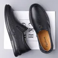 Men's black slip-on leather loafers with textured surface and metallic buckle detail - EU 38 / Black Genuine Leather