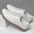 White slip-on leather shoes for men featuring flexible rubber soles and hand-stitched details - EU 38 / White