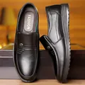 Men's black genuine leather slip-on loafers with pebbled texture and metal buckle - EU 38 / Flats / Black