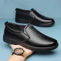 Men's black leather slip-on business loafers with silver CS metal buckle detail - EU 38 / Black