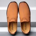 Brown slip-on leather loafers for men with decorative stitching and elastic panels - 38 / Brown