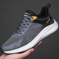 Men's breathable mesh running shoes in grey and black with vibrant orange accents - EU 39 / Gray