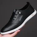 Scarpe casual da uomo in pelle nera con design traforato e suola in gomma bianca - 38 / Nero Intagliato
