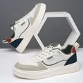 Men's casual white sneakers with blue and orange accents and thick rubber soles - EU 39 / Off White