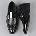 Detail of black monk strap shoes with glossy patent and crocodile-embossed leather - EU 38 / Black